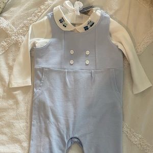 Blue overalls with white shirt with trains